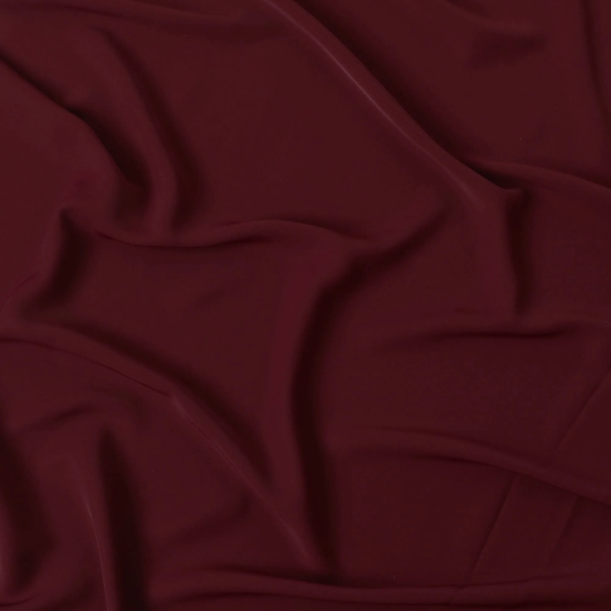 Maroon plain synthetic stretchable barbie crepe fabric-D17023